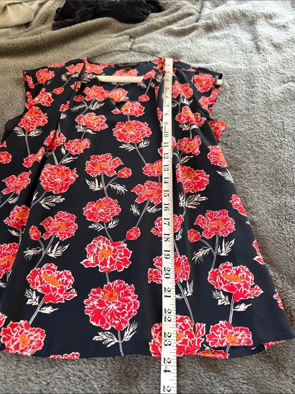 Two Banana Republic sleeveless blouses.